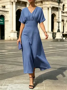 Elegant V-neck short sleeve midi dress with cinched waist and textured fabric in dusty blue