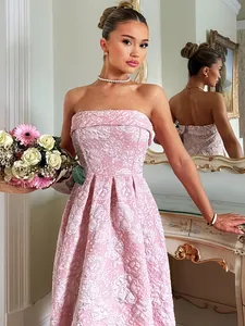 Close-up detail of elegant pink floral jacquard strapless cocktail dress for women