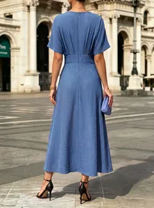 Back view of a blue V-neck midi dress featuring cinched waist and pleated detail