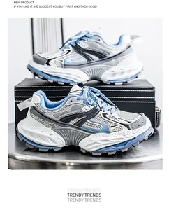 Macro view of breathable chunky dad sneakers in blue and white with a thick platform sole
