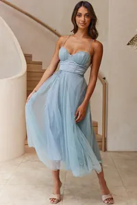 Close-up of a sexy light blue mesh midi dress with spaghetti straps and corset bodice.