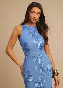 Detailed view of elegant blue evening dress with shimmering 3D floral embroidery.