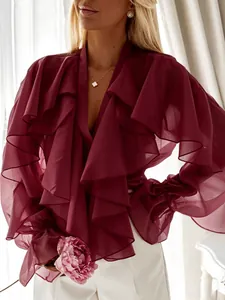 Detail view of burgundy chiffon blouse with elegant ruffles and bell sleeves for women