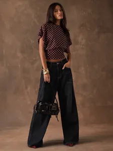 French style polka dot batwing sleeve cropped top paired with dark wide-leg denim jeans