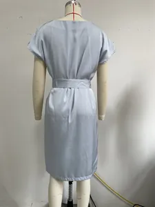Detail back view of a light blue French style satin short-sleeved dress on a mannequin
