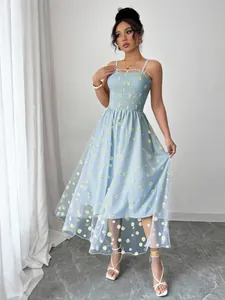 Full view of light blue daisy print mesh smocked midi dress with spaghetti straps