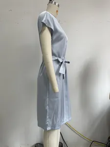 Detailed side view of light blue French minimalist midi dress with elegant belted waist