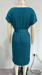 Back view of a minimalist French teal short-sleeve bodycon midi dress on a mannequin.