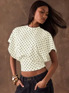 Retro French style polka dot crop top with batwing sleeves and cinched waist design