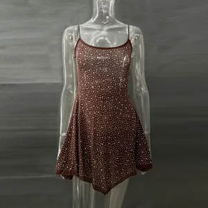 Detail view of brown rhinestone camisole dress for party wear with semi-sheer fabric.