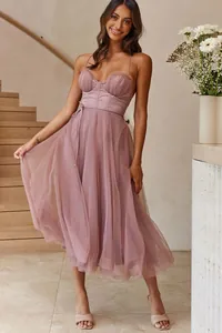 Full view of elegant mauve spaghetti strap dress with tiered mesh skirt and corset bodice
