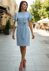 Elegant light blue French-style casual dress with waist tie shown on a model outdoors