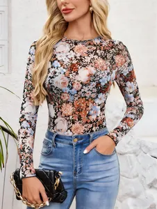 Elegant detail of women floral print mesh long sleeve slim fit top with vibrant colors
