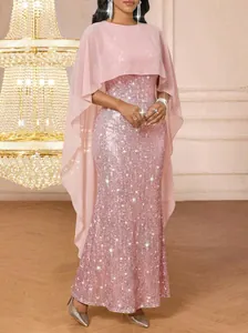 Detail showing the pink sequin texture and chiffon capelet of this elegant evening gown