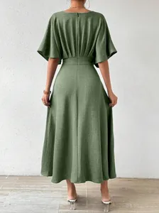 Back view of a sage green v-neck midi dress with flutter sleeves and cinched waist