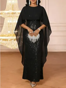 Elegant black sequin evening gown with a flowing chiffon capelet detail