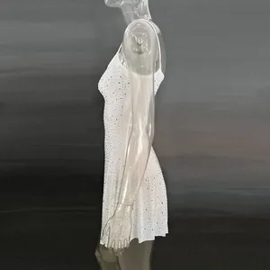 Side view detail of elegant white rhinestone semi-sheer camisole mini party dress