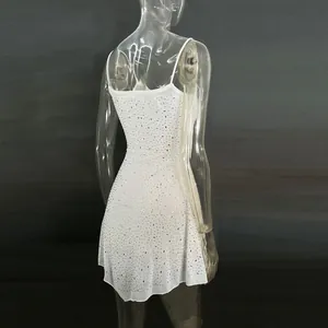 Detailed back view of white sheer spaghetti strap mini dress with rhinestone embellishments