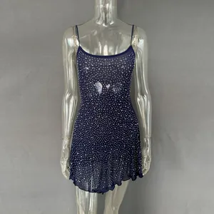 Detail view of navy blue sheer mini dress with shimmering rhinestone embellishments.