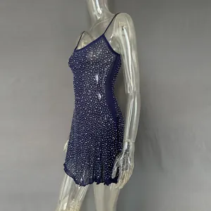 Detailed side view of navy blue sheer mini party dress with sparkling rhinestones