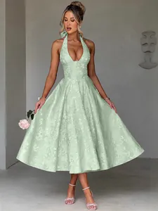 Elegant mint green halter neck jacquard dress with V-neckline and full skirt