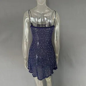 Detailed rear view of a navy blue rhinestone camisole short dress on a clear mannequin