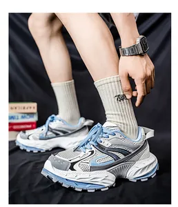 Detailed side view of men's breathable chunky sneakers with blue and white mesh design