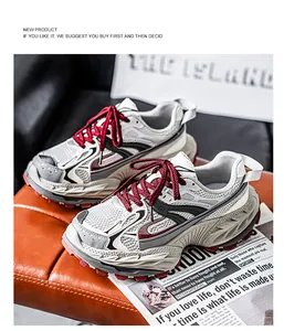 Close-up detail of stylish men's breathable chunky sneakers with mesh and red laces