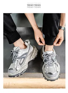 Detailed shot of men's breathable grey chunky sneakers with thick platform soles.
