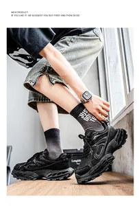 Action shot of men's black chunky sneakers with thick soles for casual sports