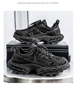Side view of stylish black chunky sneakers with thick soles and breathable mesh fabric