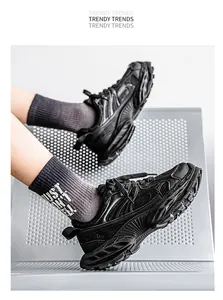 Detailed view of breathable black platform chunky dad sneakers for men on mesh chair