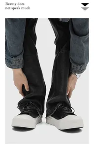 Detail shot of men's chunky platform sneakers with minimalist black and white design.