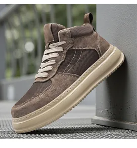 Detailed view of brown suede and breathable mesh panels on men's high-top sneaker