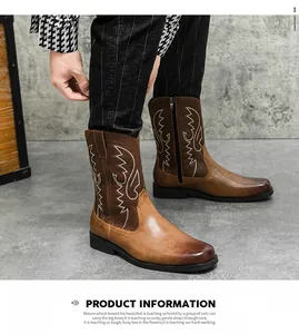 Detailed view of vintage brown embroidered cowboy boots with side zipper for men.