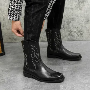 Men's vintage black cowboy boots with intricate embroidery and side zipper detail