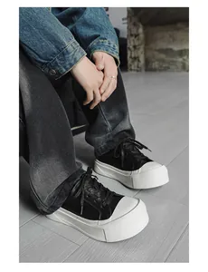 Detailed close-up of men's low-top sneakers with chunky white platform outsoles