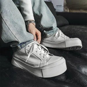 Stylish men's white platform sneakers with a unique thick-sole design for a modern look