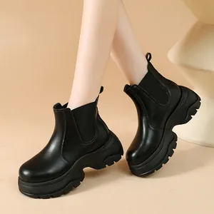 Women's black platform Chelsea boots with thick lug sole and elastic side panels