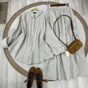 Elegant oatmeal linen two-piece set with a long sleeve shirt and matching midi skirt