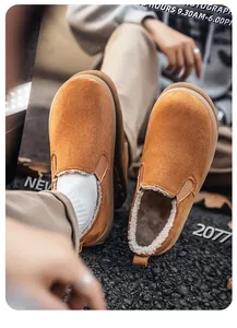 Close-up of brown suede slip-on shoes with thick plush lining for winter warmth