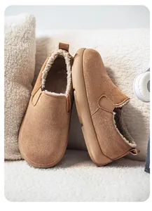 Detail side and top view of brown suede slip-on shoes with soft warm fuzzy lining
