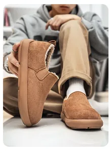 Detailed view of brown men's slip-on snow boots with thick fleece lining