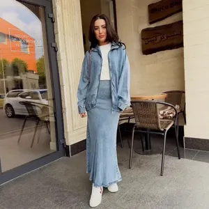 Casual light blue denim two-piece set featuring a zip-up jacket and long mermaid maxi skirt.