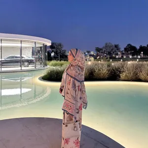 Elegant floral print long-sleeved modest robe set in luxury garden setting