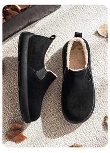 Top view of men's fleece-lined slip-on snow boots with plush interior and black suede