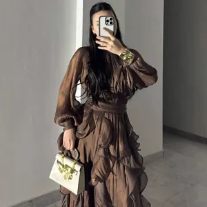 Detailed look at the brown pleated satin dress featuring an elegant ruffled A-line cut