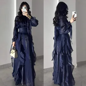 Navy blue ruffled satin evening gown with a high waist and A-line floor-length silhouette