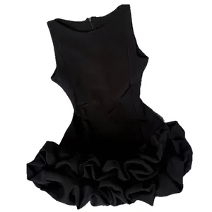 Elegant Hepburn style sleeveless black mini dress featuring a voluminous ruffled floral hem.