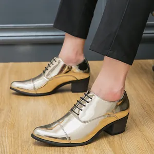 Gold metallic pointed-toe high-heeled men's oxfords dress shoes on wooden floor